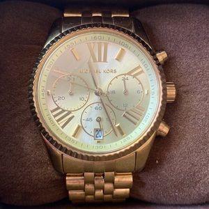 Michael Kors gold women’s multifunction watch. Never used.